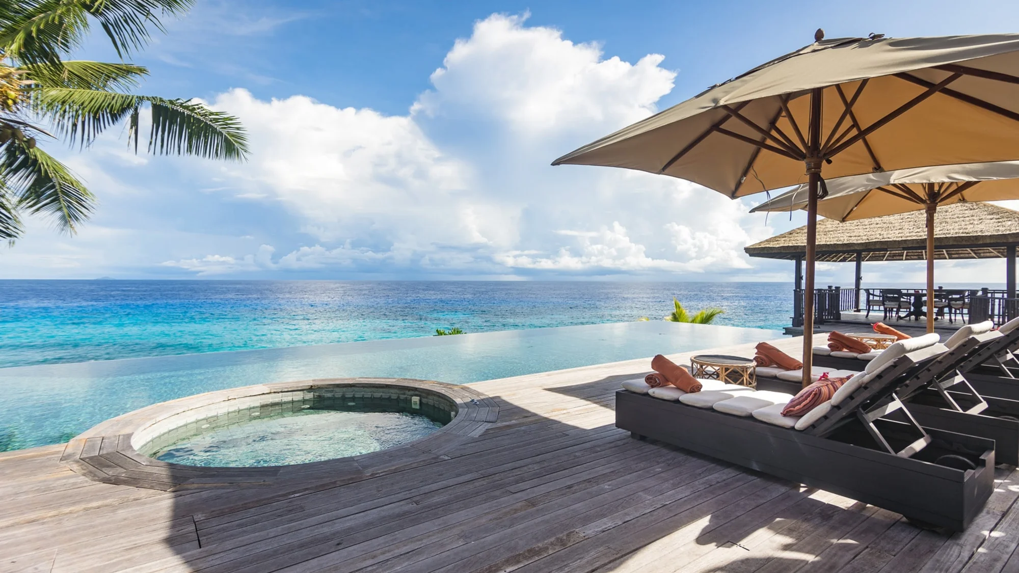 Private pool area at twin villa on Fregate Island overlooking the ocean.