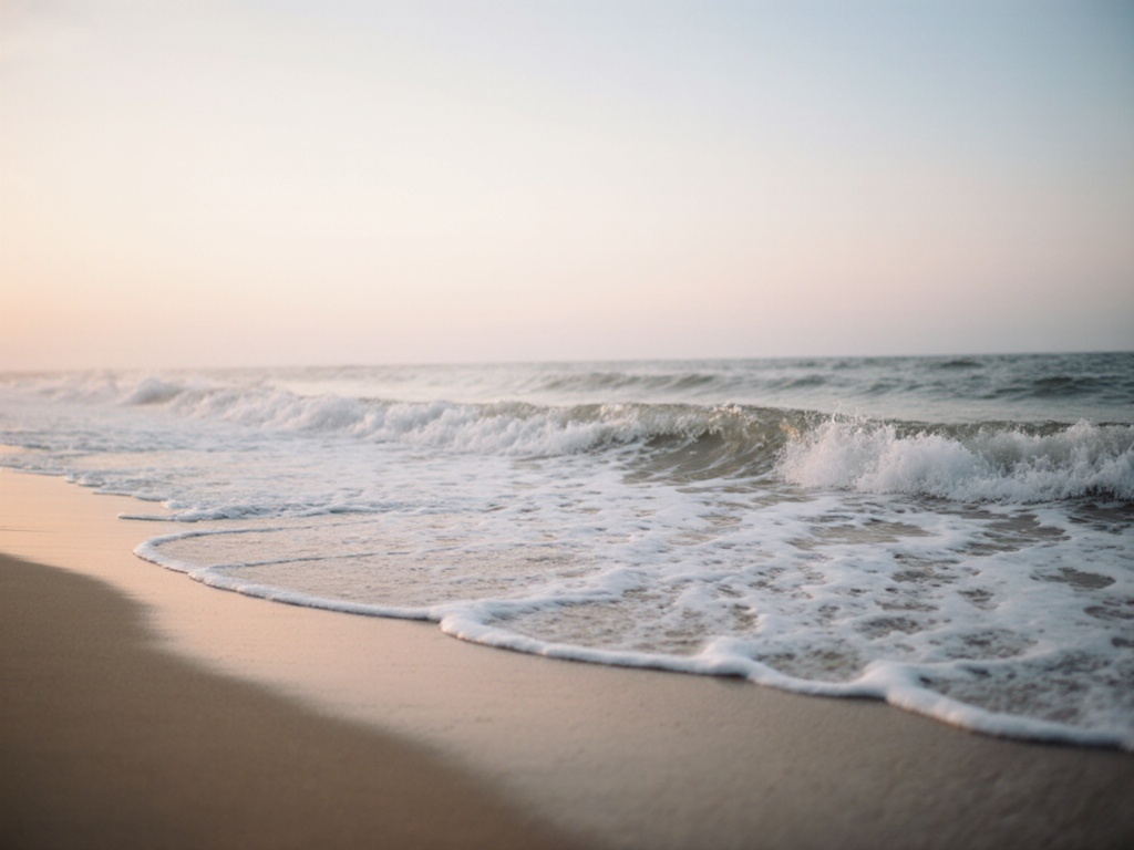Ocean wave rolling smoothly onto shore, continuous motion without breaking, soft morning light