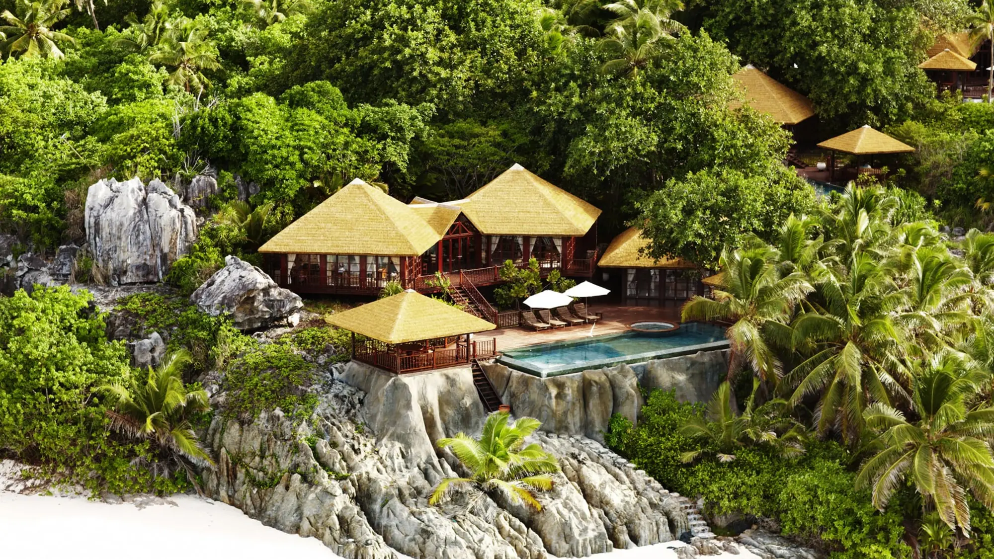 Private pool twin villa exterior on Fregate Island with natural landscaping.