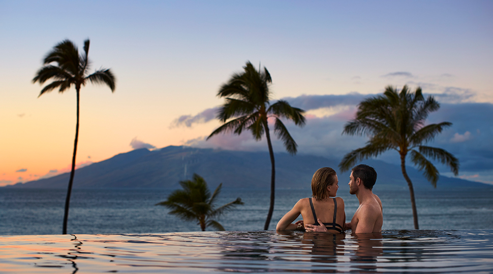 Couple relaxing at a luxury resort on their honeymoon