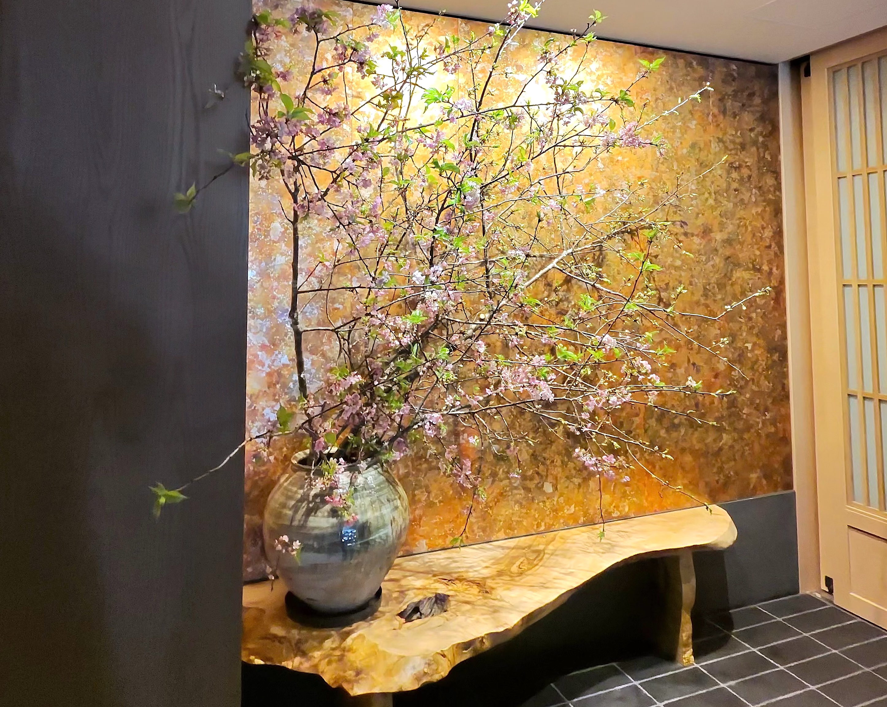 Close-up of the in-room coffee, sensha pepper chocolate chip cookie, and water.