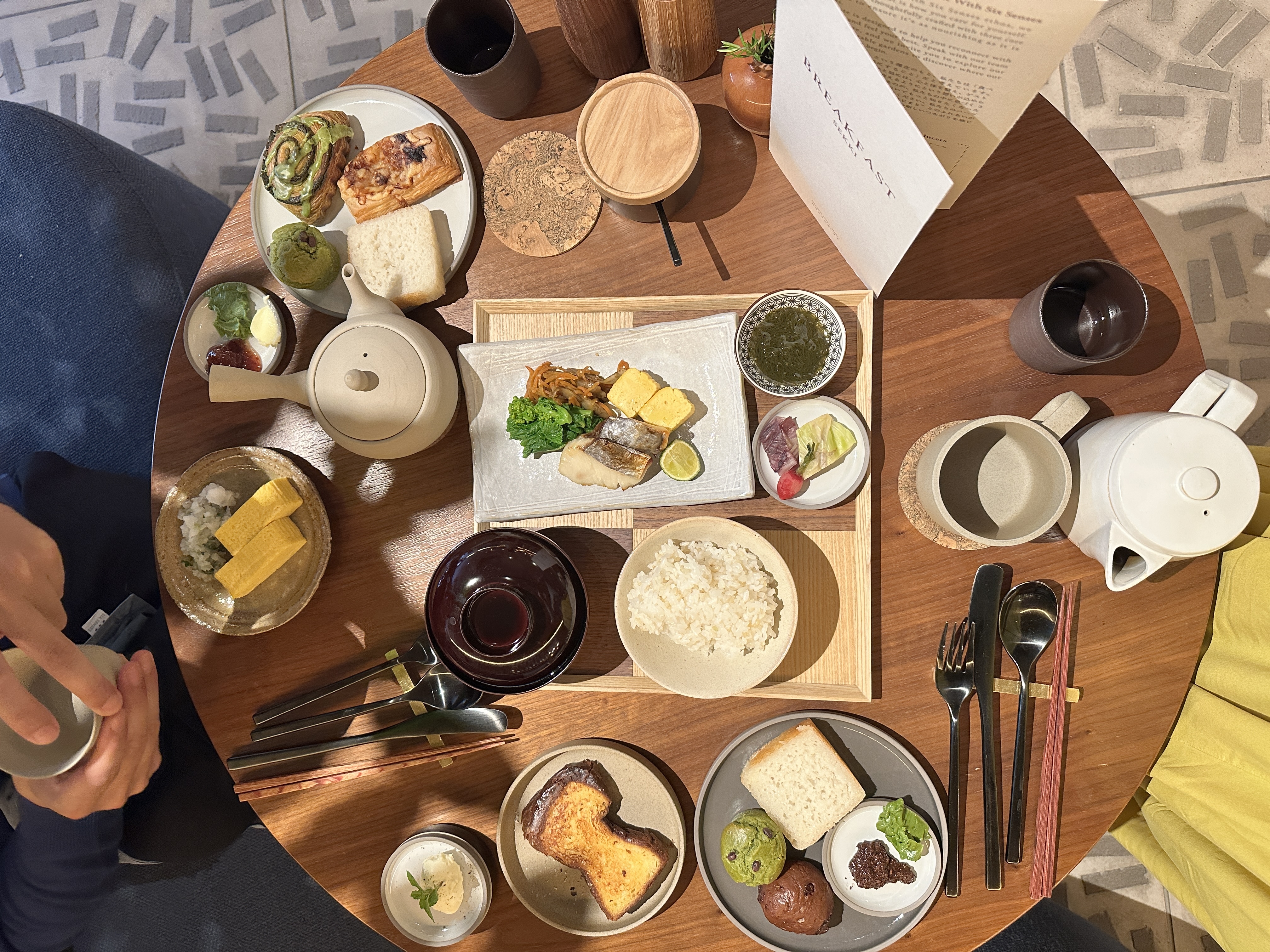 Wooden table with a spread of breakfast selection at Six Senses Kyoto.