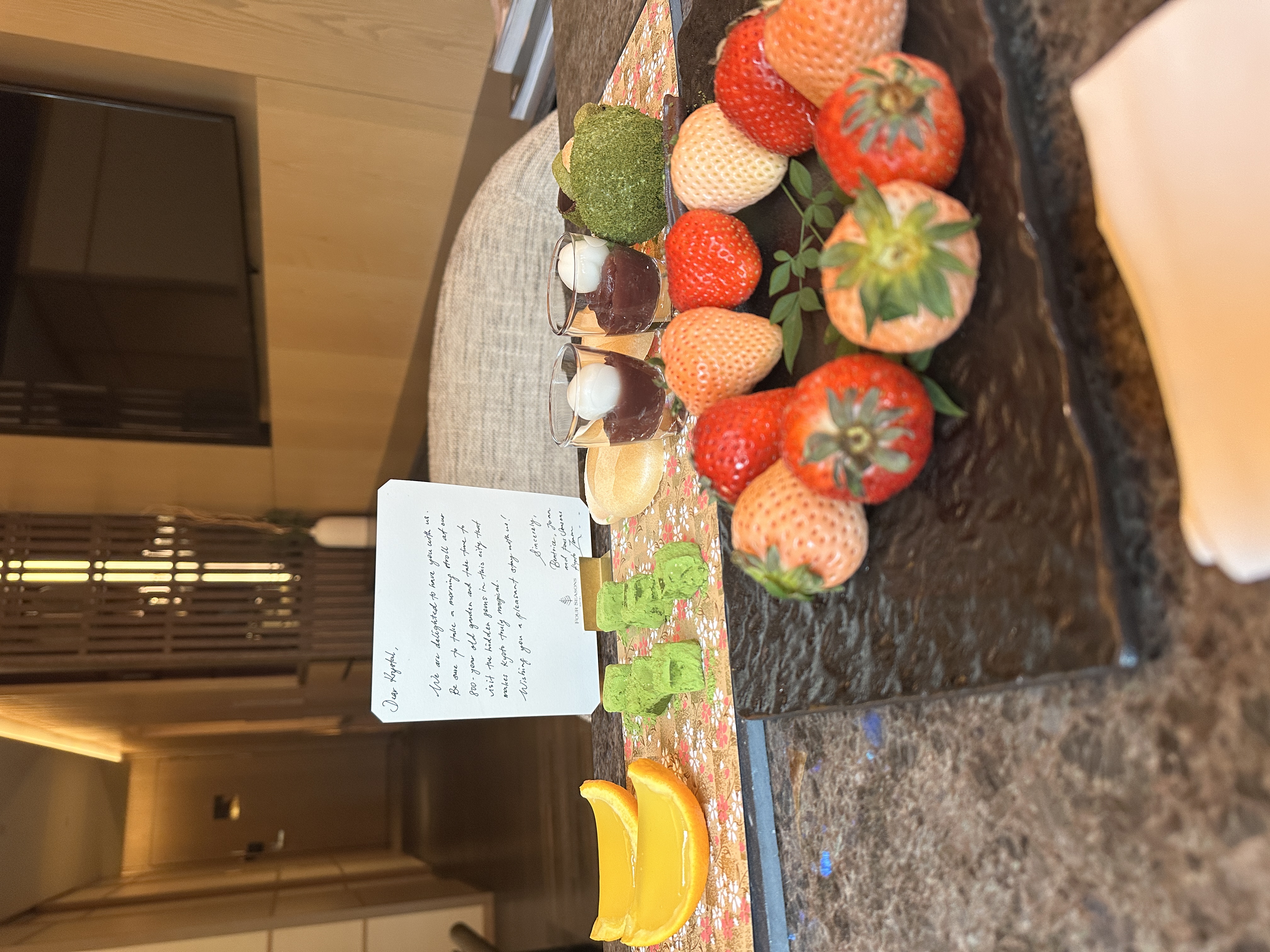 Welcome treats including three kinds of strawberries and a matcha confection in the Four Seasons Kyoto Premier Heritage Garden Room.