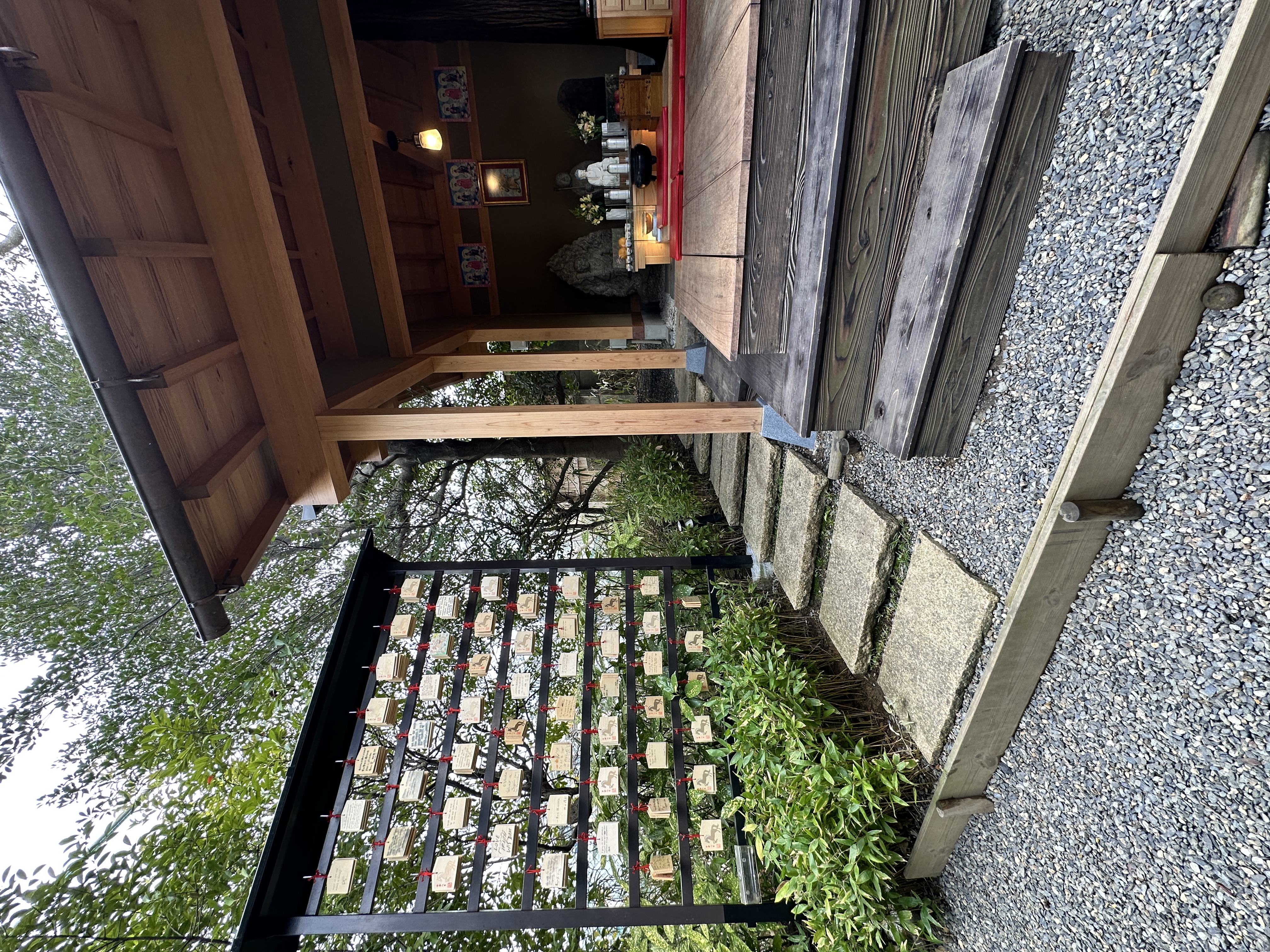 The small shrine tucked into the hillside above the pond at Four Seasons Kyoto.