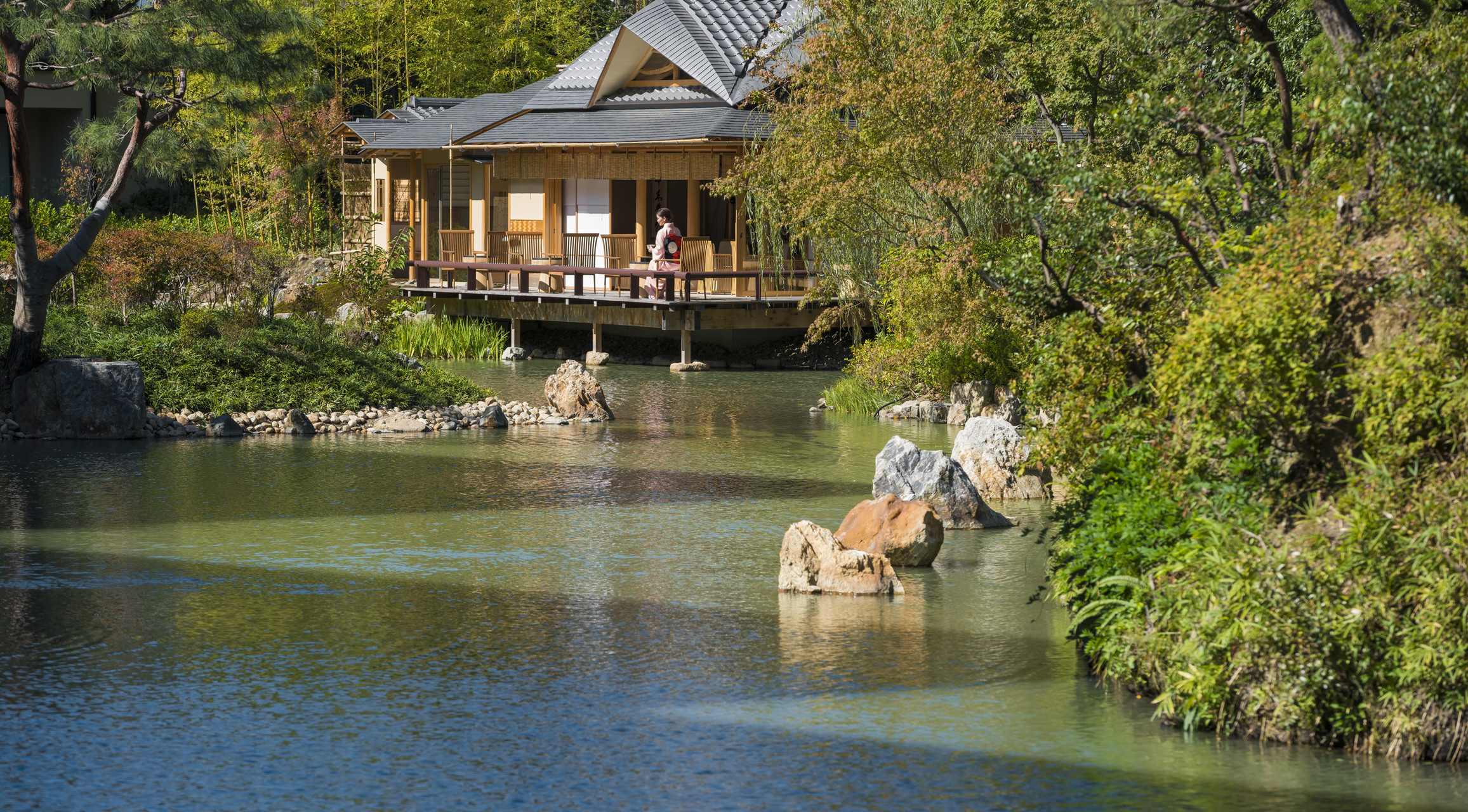 The 800-year-old Shakusui-en pond garden at Four Seasons Kyoto with koi and mandarin ducks.