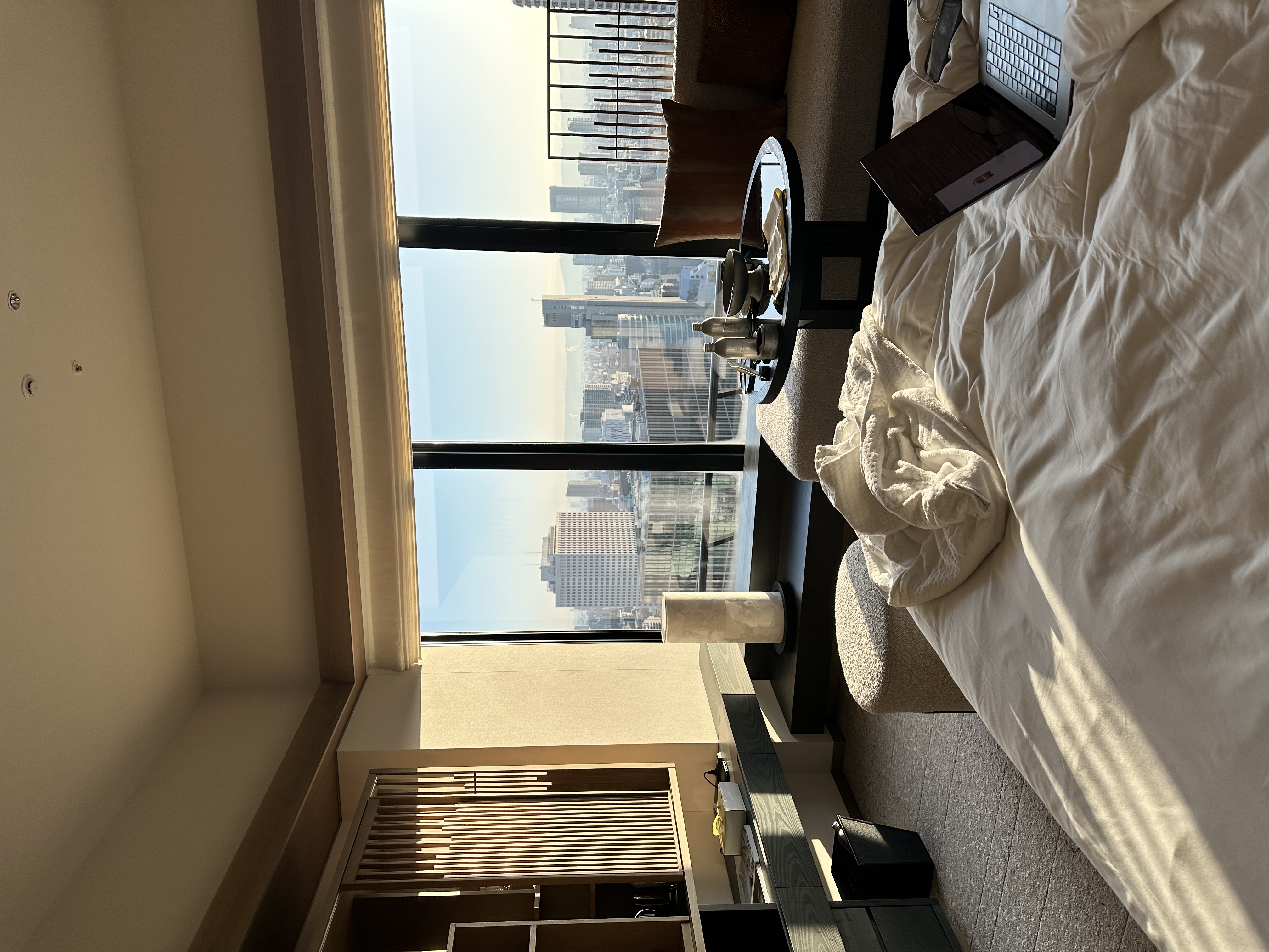 Morning city views from the Deluxe Room bed at Four Seasons Osaka.