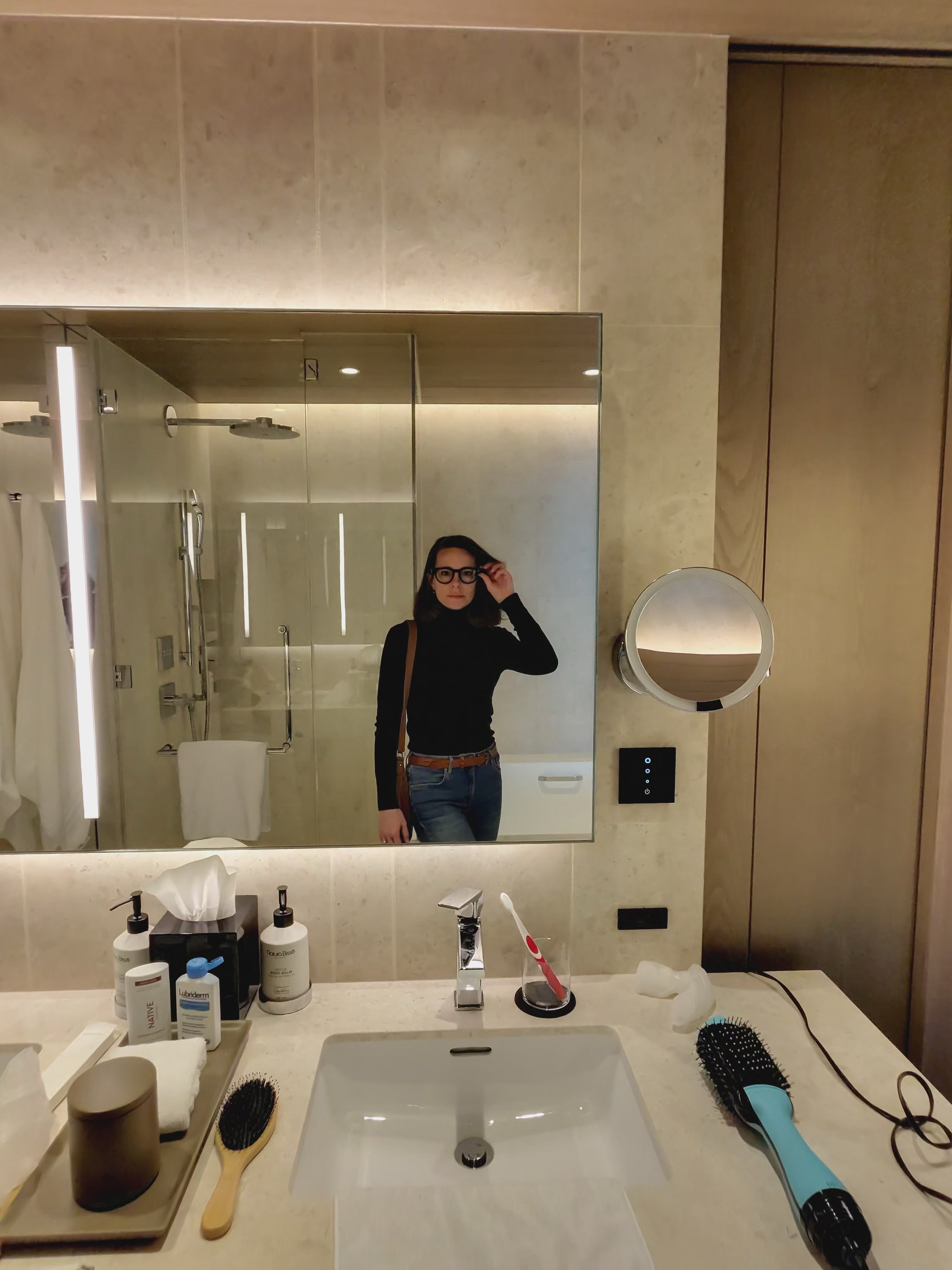 Krystal Ariel taking a bathroom selfie in Deluxe Room at Four Seasons Osaka.