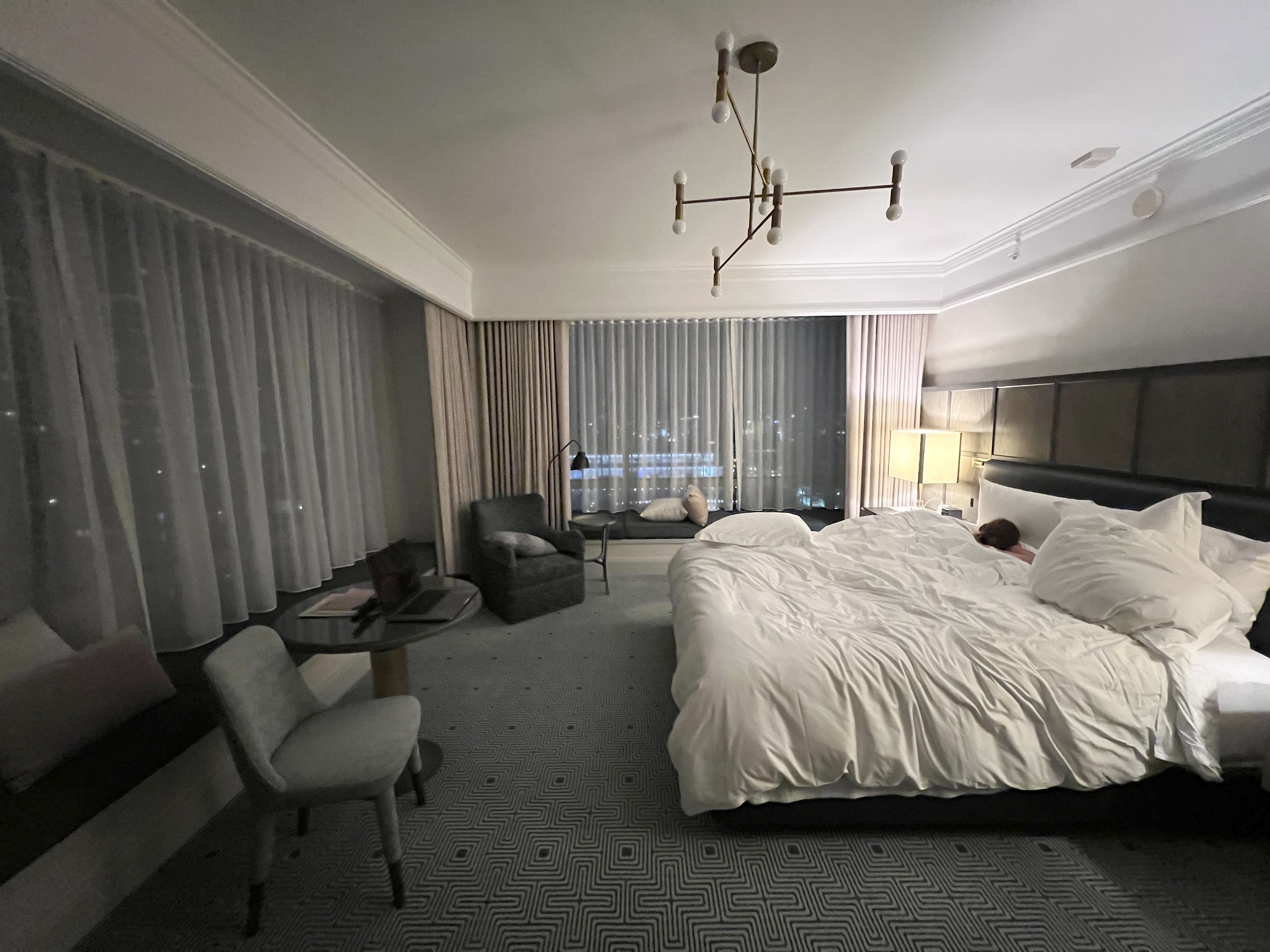 Krystal Ariel sleeping in bed of Premier Suite at Four Seasons San Francisco.