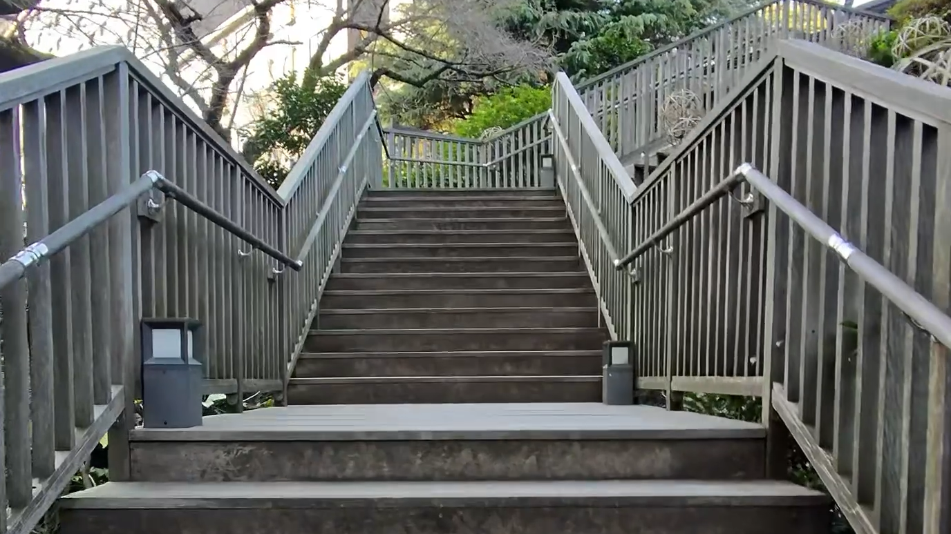 Stairs leading up through the Takanawa Japanese Garden near Takanawa Hanakohro in Tokyo.