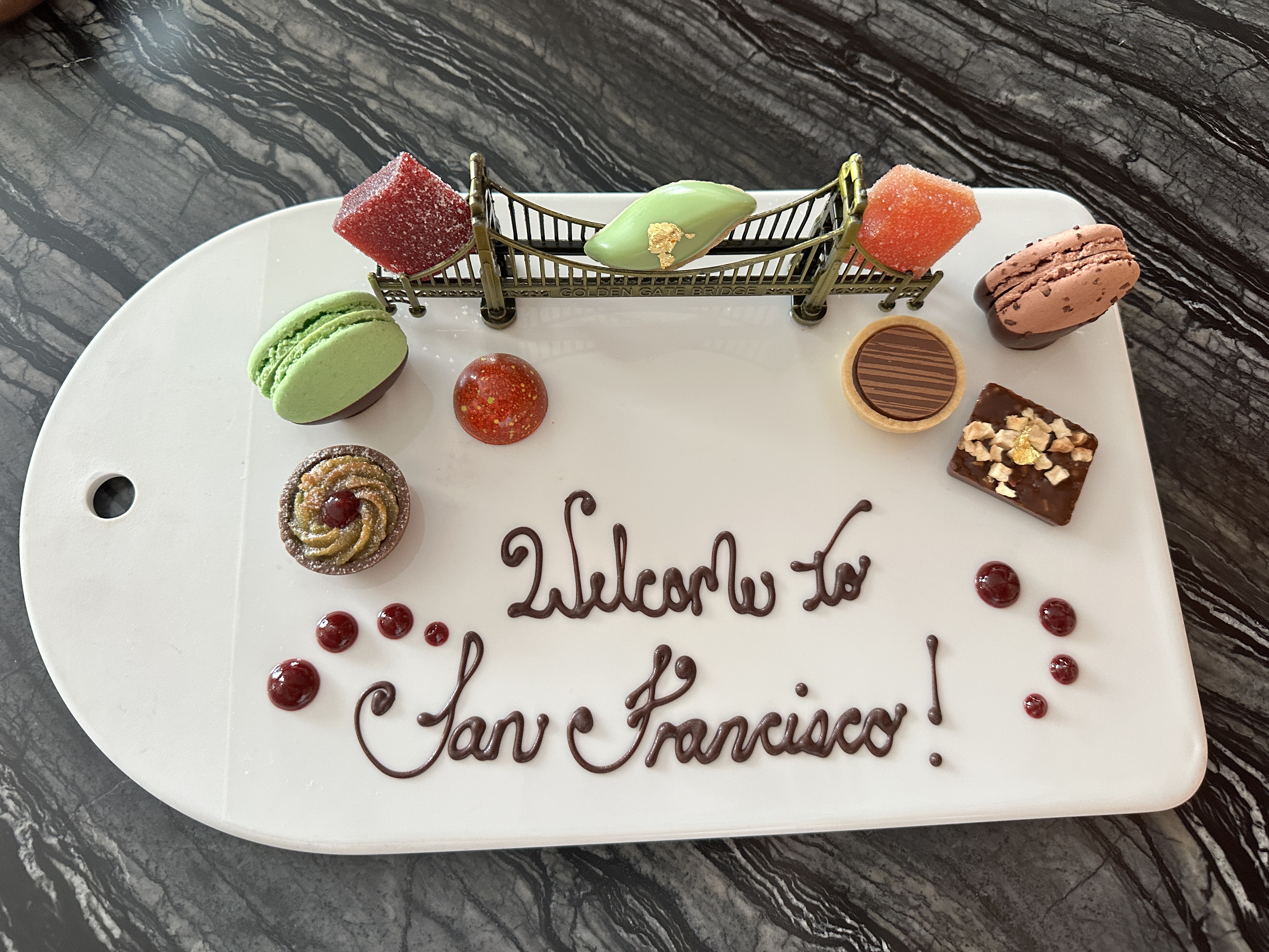 Plate with Welcome to San Francisco and assortment of sweet treats at Four Seasons San Francisco