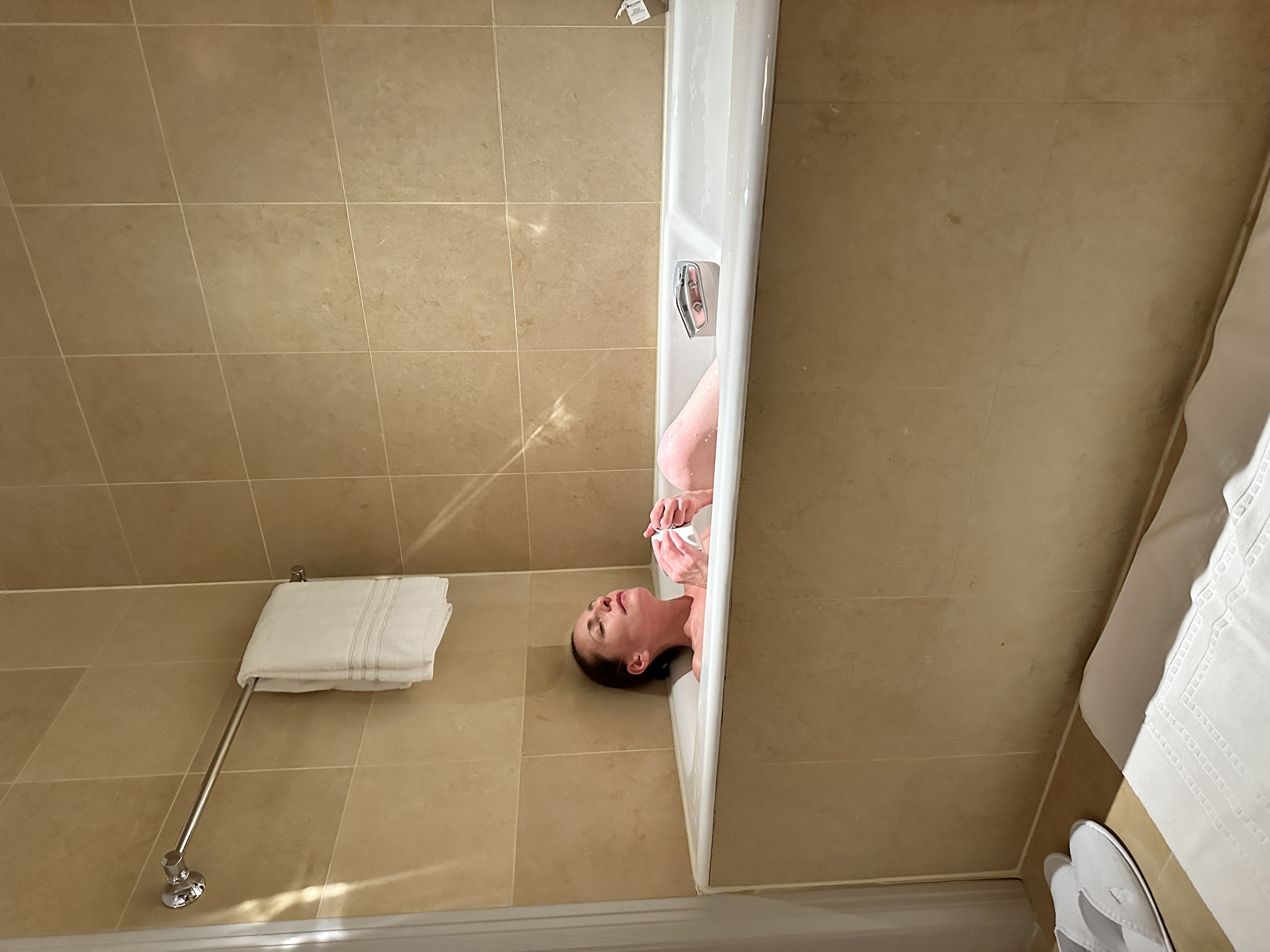 Krystal Ariel relaxing in the bathtub of the Premier Suite at Four Seasons San Francisco.